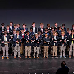 The School chior singing on stage. Links to Tangible Personal Property property.jpg