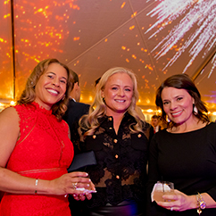 Three women smiling. Link to Life Stage Gift Planner Under Age 60 Situations.