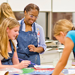 An art teacher watching over her students. Links to Gifts from Retirement Plans