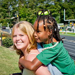 Two students smiling. Links to Gifts of Life Insurance lifejpg.jpg