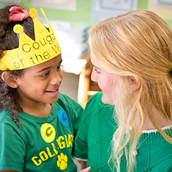 Two students smiling. Links to Gifts by Will